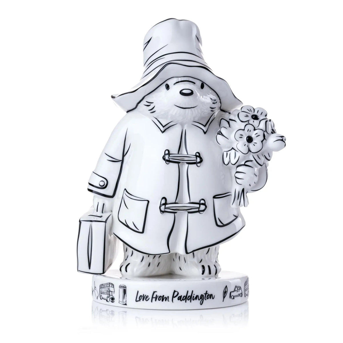 Fine bone china figurine of a sketch-style Paddington figure holding a flower bouquet