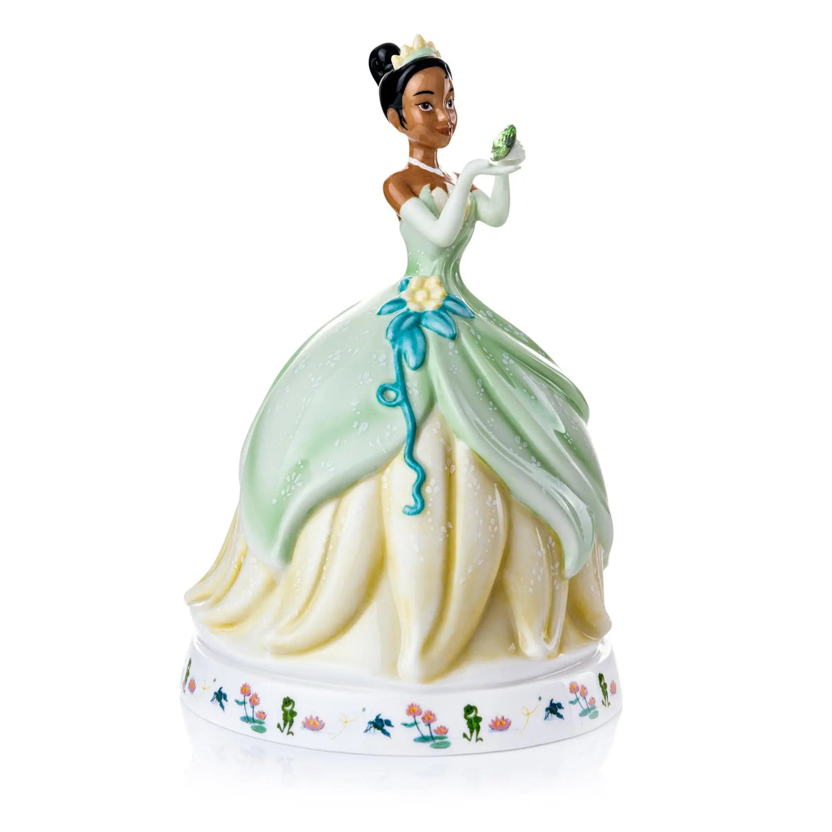 Green and cream ballerina porcelain figurine with floral base and raised hands