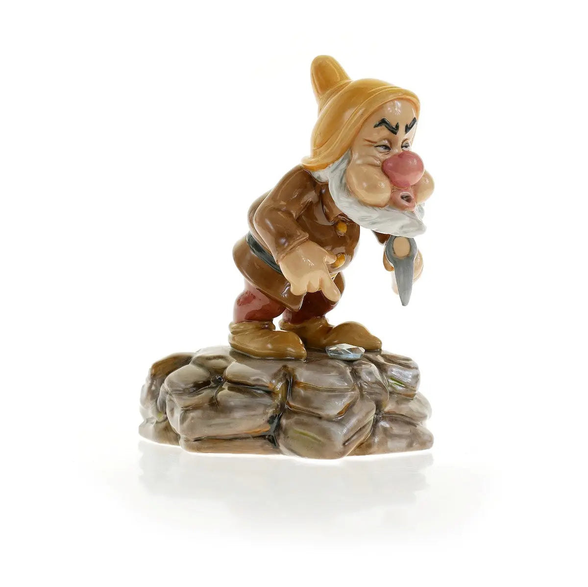 Fine bone china dwarf figurine in brown outfit, white beard, on gray rock base
