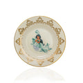 Decorative porcelain plate with gold floral rim and teal mermaid center