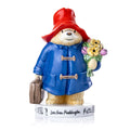 Fine bone china figurine teddy bear in blue coat and red hat, holding flower bouquet