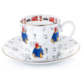 Fine bone china cup and saucer set, white with colorful Paddington-style bear and London icons