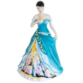 Fine bone china woman figurine front view holding a teacup, teal dress with floral motifs