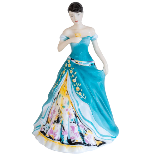 Fine bone china woman figurine front view holding a teacup, teal dress with floral motifs