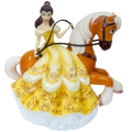 Decorative porcelain rider figurine in yellow dress on an orange horse with white mane