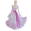 Porcelain lady figurine in white and pink floral off-shoulder dress with ribbon sash