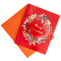 Red Christmas greeting card with floral wreath and Merry Christmas text