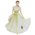 Fine bone china doll figurine in off-shoulder white gown with green sash, standing
