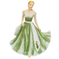 Porcelain doll figurine in green off-shoulder dress with white bodice and floral hem