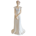 White fine bone china bride figurine with floral hairpiece and long flowing gown