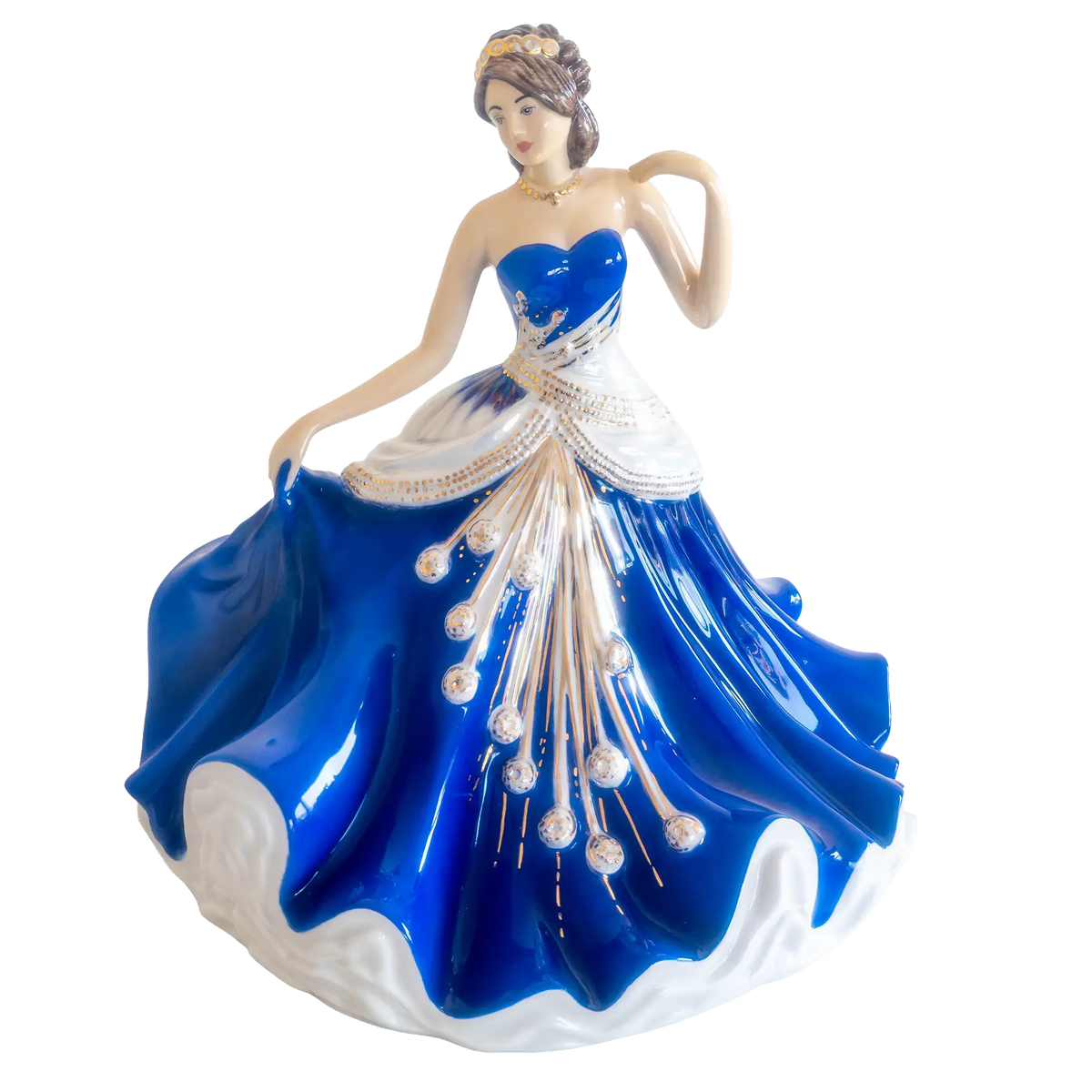 Fine bone china ballerina figurine in royal blue ball gown with white accents, arms posed