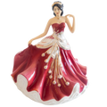 Porcelain lady figurine in strapless deep red dress with white ruffled hem and gold details