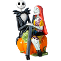 Fine bone china figurine of Jack and Sally, standing together on a pumpkin base