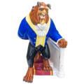 Fine bone china figurine of a lion-like beast in blue coat, holding white chair