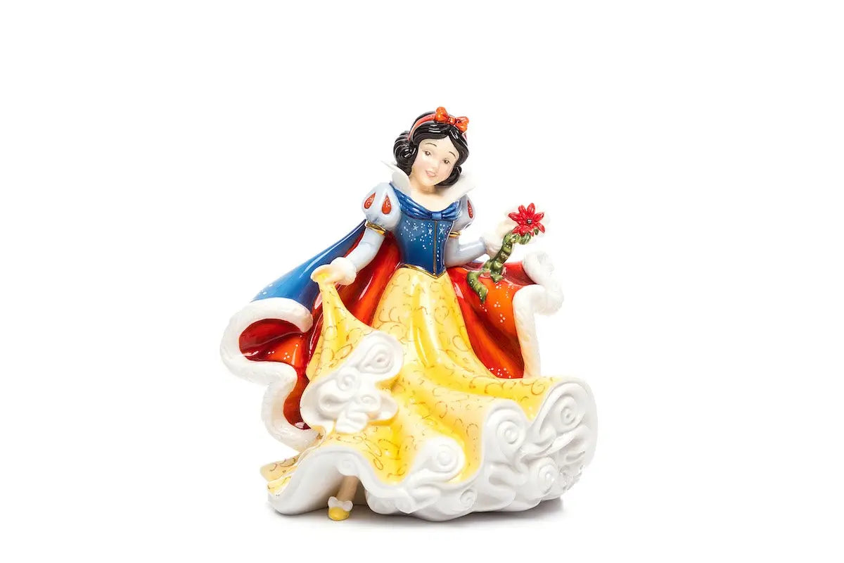 Fine bone china princess figurine, blue cape and yellow skirt, holding a bouquet