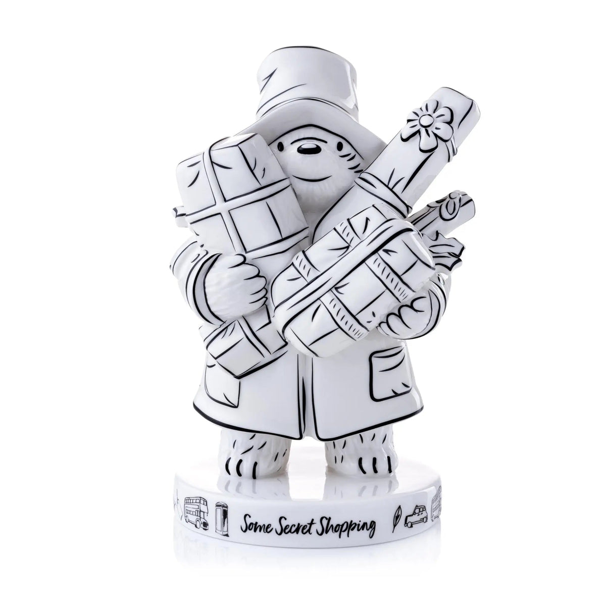 Paddington fine bone china figurine in sketch style, wearing coat and hat, holding parcels