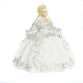 Fine bone china figurine of blonde girl in ornate praying dress, hands together
