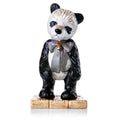 Fine bone china bear figurine in black coat with checkered vest and small staff, standing