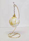 Gold fine bone china ornament stand holding white star-pattern globe ornament