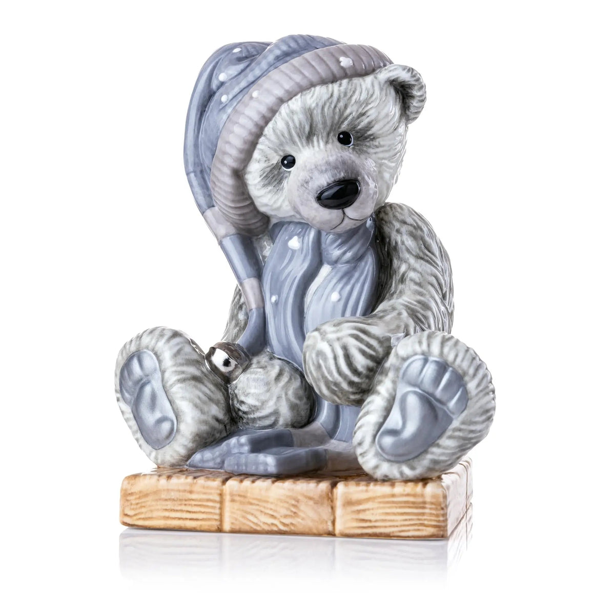 Fine bone china teddy bear figurine in blue hood and scarf, seated on base